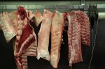 meat hanging in butchers rack