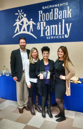 Food Drive coordinators and staff celebrate a successful year. From left: Blake Young, CEO – Sacramento Food Bank & Family Services; Peggy Marshall, Food Drive Coordinator – Sacramento Food Bank & Family Services; Marilyn Lluch, Food Drive Coordinator – California Environmental Protection Agency; Taylor Roschen, Statewide Food Drive Coordinator – California Department of Food and Agriculture (Source: Zsi Widman)