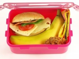 lunch box with sandwich, banana and cookie
