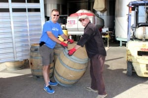 Atwater FFA Advisor Dave Gossman and Inglenook Winery's Amabassador harold Francis load up empty wine barrels that will be provided to the Atwater High School Agriculture Department for student FFA shop projects