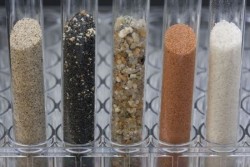 glass testing tubes with different soils