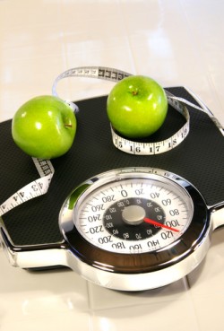 Weight scale with green apples