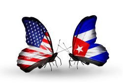Two butterflies with flags on wings as symbol of relations USA and Cuba
