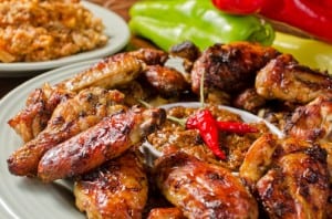 A plate of barbequed chicken wings.