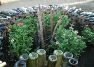 Wine bottle keyhole garden