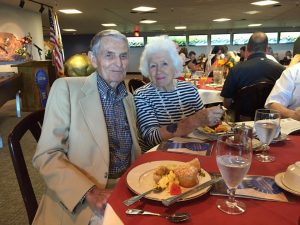 Former CDFA director Richard Rominger and his wife, Evelyne, at this morning’s Ag Heritage Breakfast. Evelyne is sporting a temporary blue ribbon tattoo supplied by the California State Fair. (Image courtesy of C DFA)