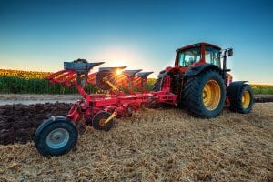 farmer-in-tractor-preparing-land-with-cultivator