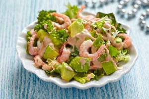 Fresh green salad with shrimp and avocado